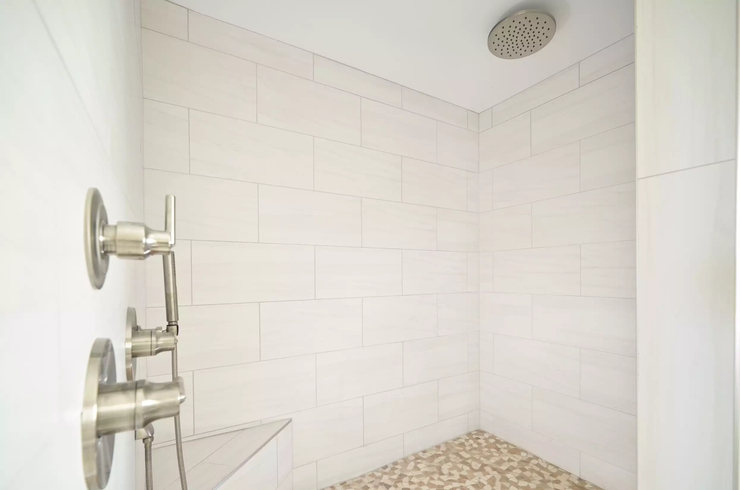 Walk in shower with modern tile and high end fixtures